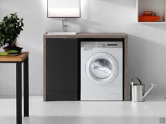 Example of an open compartment perfect for housing a washing machine, created thanks to overlapping sides and top. Finish not available