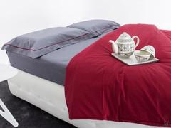 Percalle bedding set including fitted sheet and pillowcases in Grey with contrasting piping in the Scarlet colour of the duvet cover