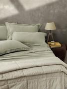 Bedlinen set in delavé linen here proposed in the coordinating colours Dill Green and Natural