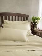 Bed set with sheet and pillowcases with hemmed flyleaves with simple topstitching