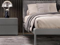 Virgo bed in the version with matt lacquered bed frame (colour not available) and headboard with upholstered double cushion