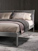 Virgo bed in the version with matt lacquered bed frame (colour not available) and headboard with upholstered double cushion