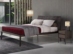 Modern and coordinated sleeping area with bed and bedside table Taurus in wood