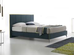 Upholstered bed Camaleonte with quilted headboard and contrasting headboard profiles