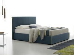 Upholstered bed Camaleonte with smooth headboard and contrasting ruffle profile