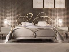 Ghirigori wrought iron double bed by Cantori with champagne silver leaf work