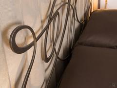 Headboard with artistic design, made by the interweaving of lines