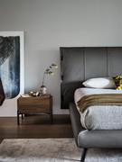 Bed Cuff by Bonaldo with upholstered headboard and high feet