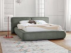 Upholstered bed Fluff by Bonaldo, recognizable by the soft lines that enhance its softness