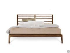 Seika wooden bed in natural walnut wood finish