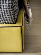 Detail of Smart high bed frame in Lora 501 yellow fabric with Lora 800 black piping (Lora upholstery not available)