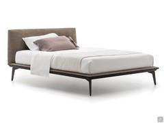 Wooden bed with high feet Lacrosse in the version with upholstered headboard and bed frame