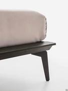 Detail of all-wood bed frame, also available matte lacquered