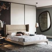 Ludovic bed with high winged headboard by Cattelan. Bed available in 4 measurements