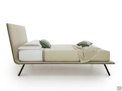 Side view of the minimalist upholstered bed