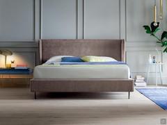 Headboard enhanced by shaped and movable side flaps