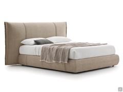 Bed with upholstered headboard and vertical stitching Jim; the cover can be chosen among a variety of materials and colours