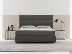 Freeport double bed with bespoke headboard, with upholstered wall panels in the middle of the headboard