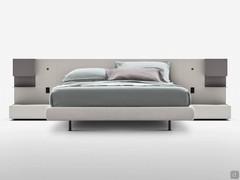 Freeport double bed with bespoke headboard with wall mounted metal shelves and spot-lights on the side