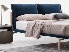 Headboard with padded, upholstered cushions