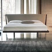 Double bed with solid wood bed frame and upholstered leather or eco-leather headboard