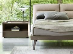 The outline of the bed-frame is characterised by a 45° cut with smooth corners