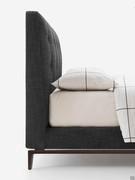 Bed Ramir upholstered in fabric with metal "trestle" feet