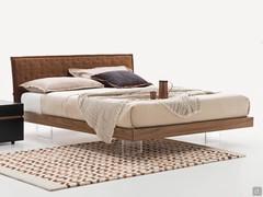 Nordic-style wooden bed Marlin: natural walnut veneer bed frame and headboard and clear methacrylate feet, optional textile headboard cap