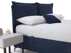 Focus on the slim headboard with a 4 cm thickness, to which the soft cushions with ruffles are applied; Aimi dark blue fabric upholstery