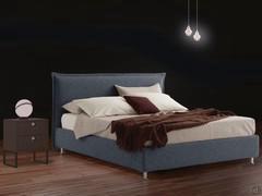 MilleLetti bed with a 24 cm high bed frame elevated off the ground, available as a fixed model or with a storage container; 10 cm thick headboard with ruffles