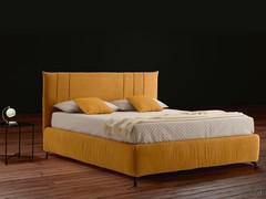 MilleLetti bed in the version with a 30 cm high Tender padded bed frame and Soft headboard with vertical stitchwork