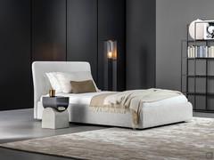 Bed Tonight by Bonaldo in the alternative version with high upholstered bed frame and storage box