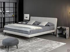 Upholstered textile bed Tonight by Bonaldo, offered here in the "Air" version with a slim bed frame and high feet in painted metal