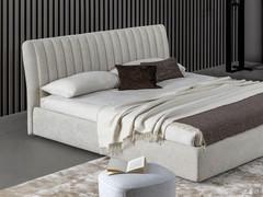 Upholstered textile bed Tonight by Bonaldo in the version with upholstered bed frame, storage box and headboard with vertical quilting