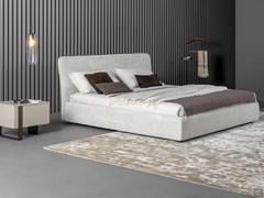 Upholstered textile bed Tonight by Bonaldo with high bed frame and storage box, resting on the floor on low wooden or painted metal feet