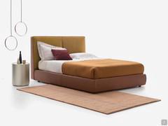 Laika bed in the two-tone version, offered here with leather bed frame and headboard and cushions