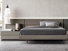 Layout of bed-frame and central padded headboard, completed with lacquered panels and wall-mounted elements