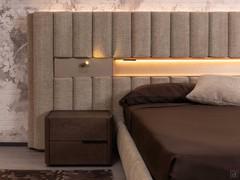 Detail of the platform bed with upholstered wall panelling, equipped with optional spotlight and illuminated open compartment