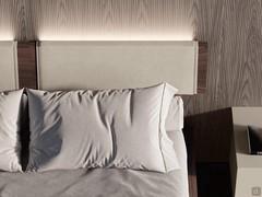 Leather-covered headrests, 83 cm wide and freely positionable along the headboard