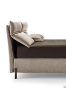 Detail of Lesley bed with reclined headboard cushion