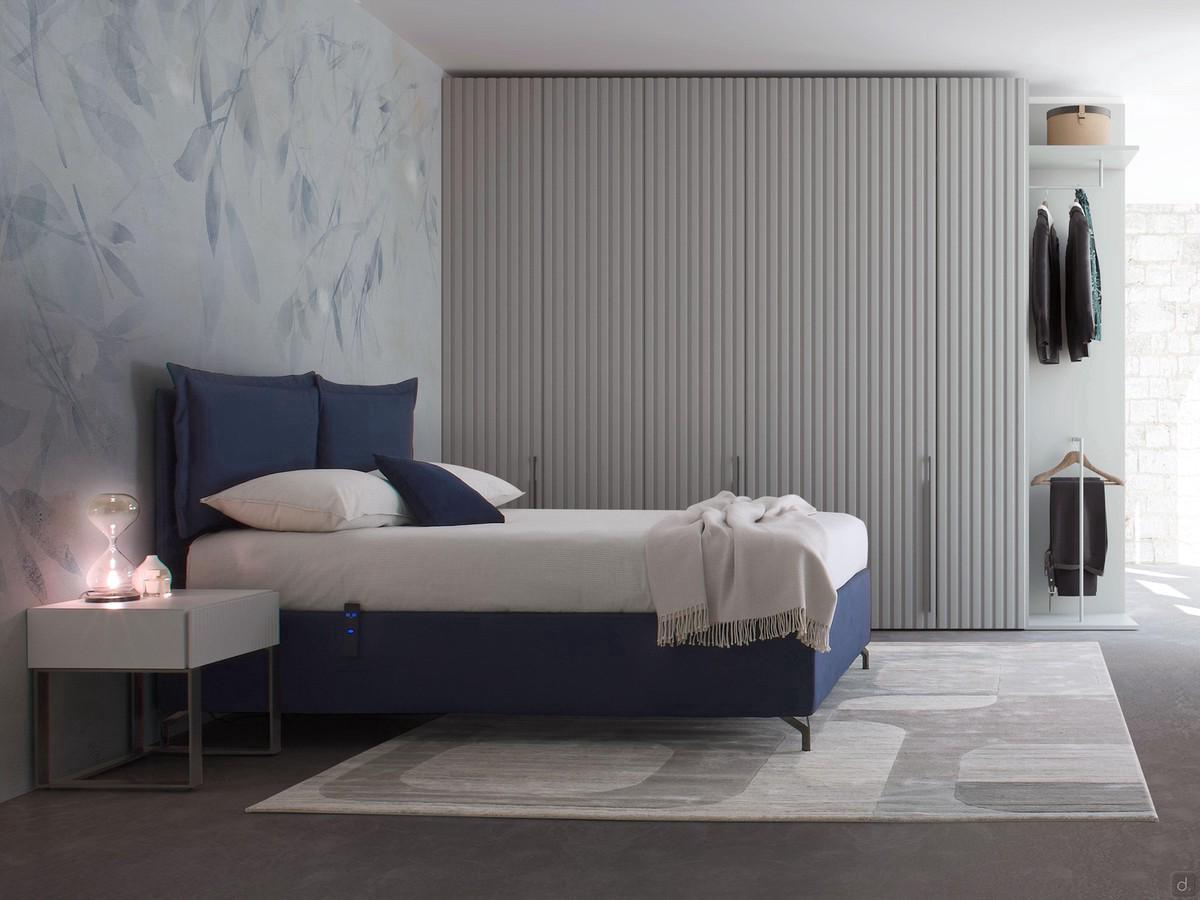 MilleLetti fabric upholstered bed with an electric storage bed mechanism, in the version with a 30 cm high bed frame and headboard with applied cushions