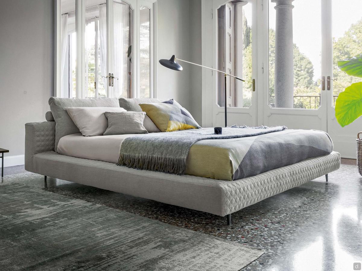 Double bed in quilted fabric Owen by Bonaldo, with high metal feet