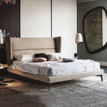 Ludovic bed with high winged headboard by Cattelan. Nubuck cover also available in fabric, faux leather or leather for a refined bedroom