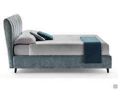 Side view of the Joao bed highlighting the proportions of the high headboard and the h.25 bed frame with high feet and storage box