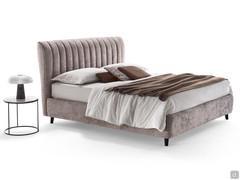 Joao shaped high headboard bed with vertical striped quilting that enhances the tall, slender effect