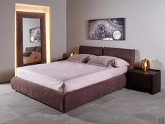 Astoria upholstered double bed in leather, completed by Amandla bedside tables and Sidony mirror