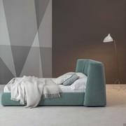 Basket upholstered bed with shaped headboard by Bonaldo with enveloping and cosy design