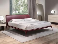 Cantori's Iseo bed here proposed in the version with smooth upholstered headboard covered in Vinaccia Anilina leather, combined with bed frame and feet in Vinaccia lacquered aluminium