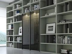 Aliant 05 modular bookcase with doors, with bar cabinet compartment attesting to its versatility