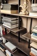 Detail of brushed bronze lacquered shelves